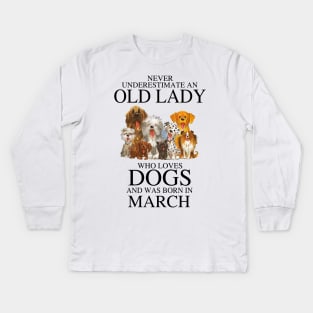 Never Underestimate An Old Lady Who Loves Dogs And Was Born In March Kids Long Sleeve T-Shirt